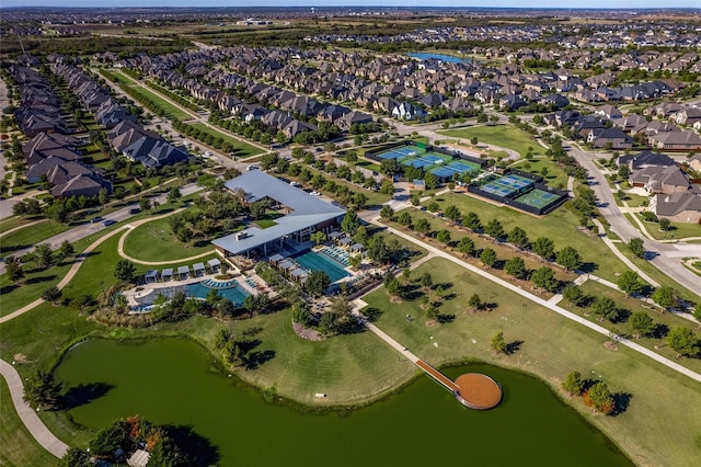 birds eye view of property featuring a water view and a residential view