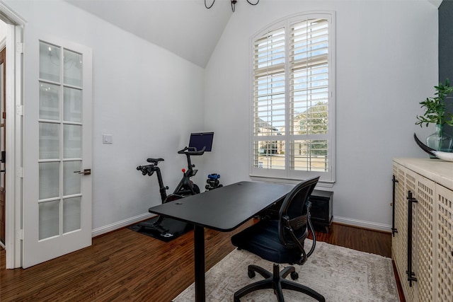 office with baseboards, vaulted ceiling, and wood finished floors