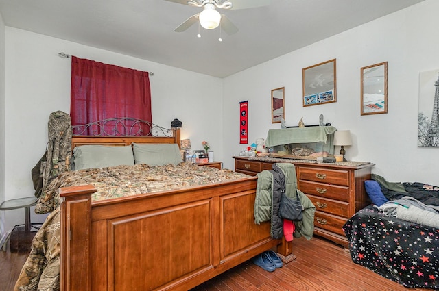 bedroom with ceiling fan and wood finished floors