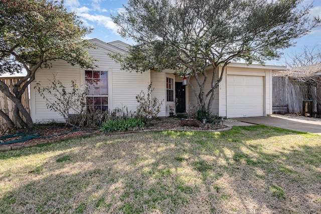 ranch-style house with a garage, driveway, a front yard, and fence