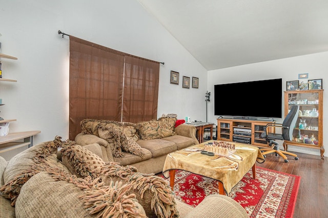 living area featuring lofted ceiling and hardwood / wood-style floors