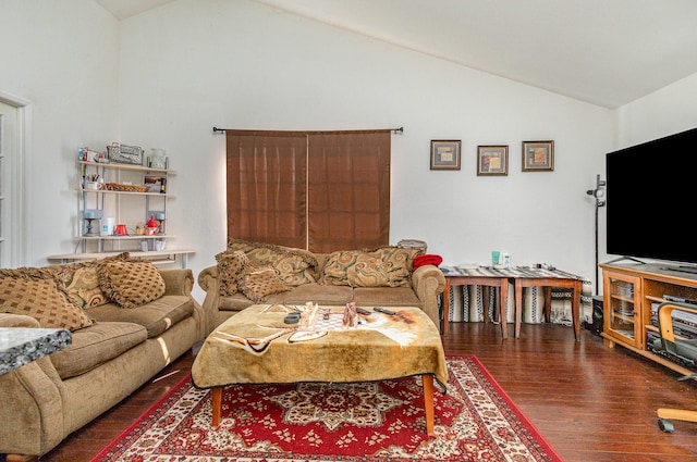 living area featuring lofted ceiling and wood finished floors