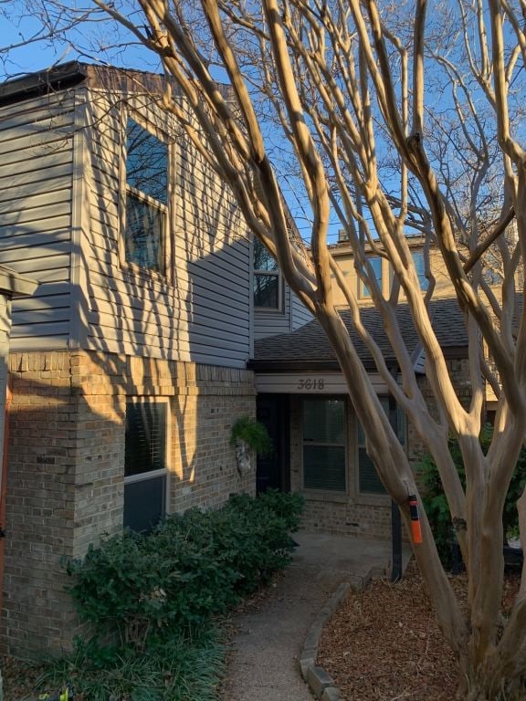 view of home's exterior featuring brick siding