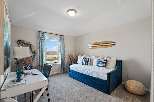 carpeted bedroom featuring baseboards