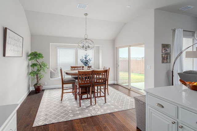 dining area with lofted ceiling, dark wood-style floors, visible vents, and a chandelier