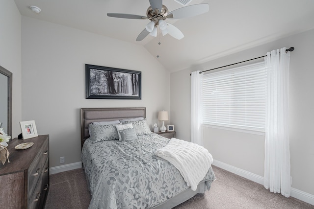 carpeted bedroom with baseboards, lofted ceiling, and ceiling fan