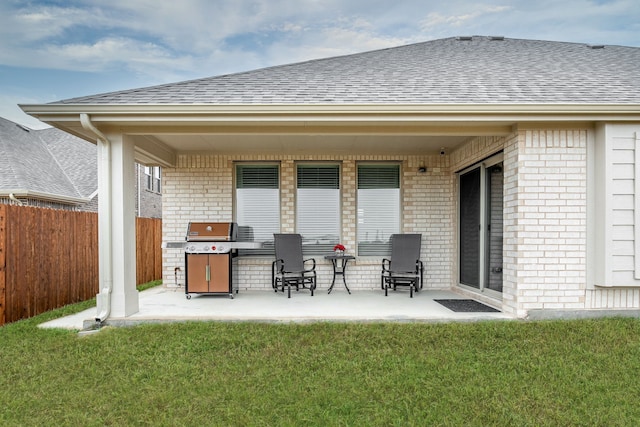 view of patio featuring fence and grilling area