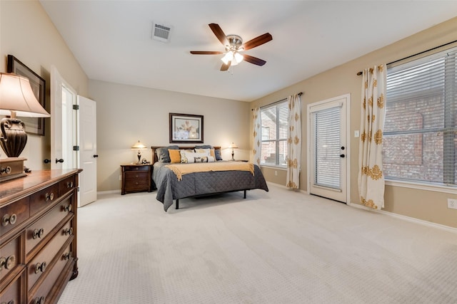 bedroom featuring light carpet, visible vents, baseboards, a ceiling fan, and access to outside