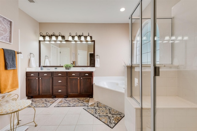 full bath featuring a stall shower, double vanity, a garden tub, and tile patterned floors