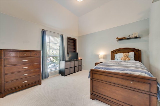 bedroom with light carpet and lofted ceiling