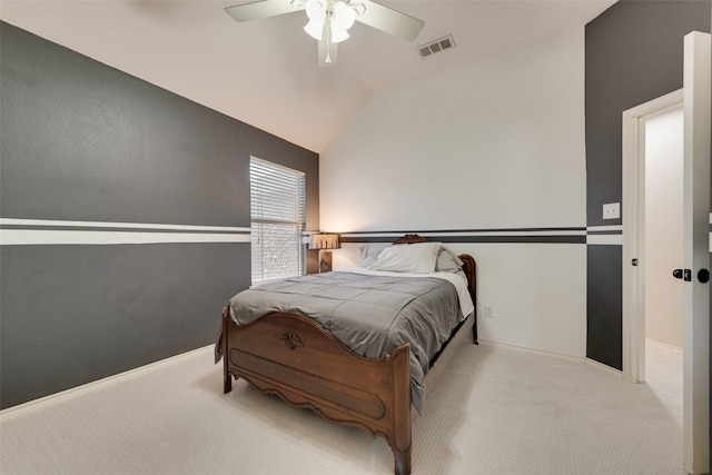 bedroom with lofted ceiling, visible vents, a ceiling fan, carpet flooring, and baseboards