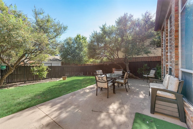 view of patio featuring a fenced backyard and outdoor dining space