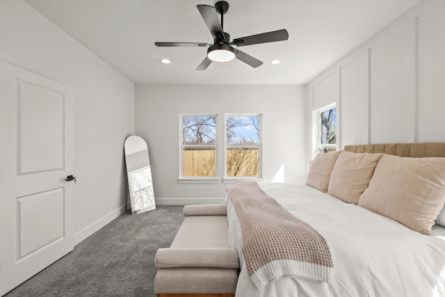 bedroom featuring carpet floors, multiple windows, recessed lighting, and baseboards