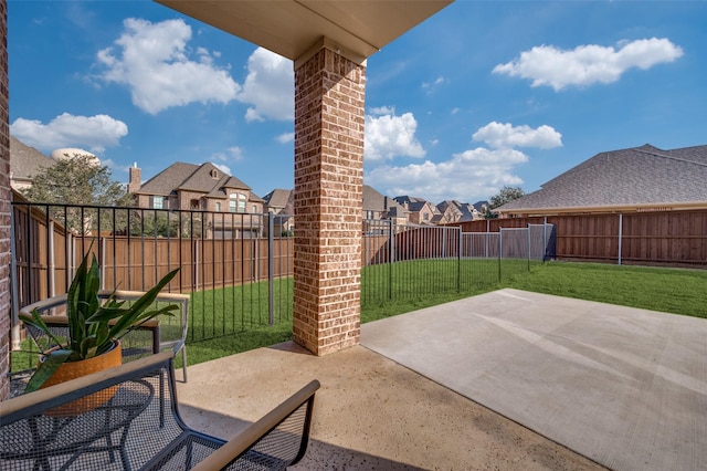 view of patio / terrace with a fenced backyard and a residential view