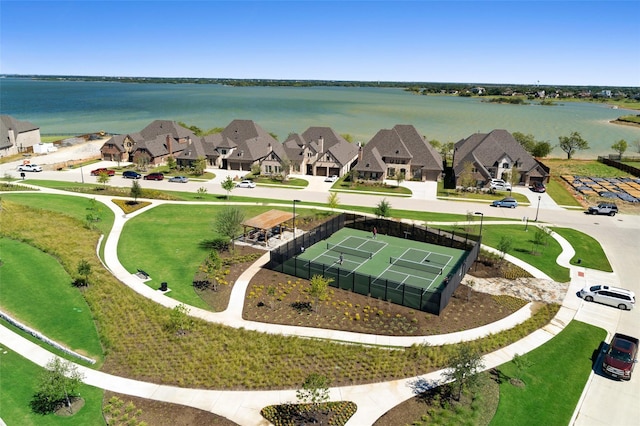 bird's eye view with a water view and a residential view