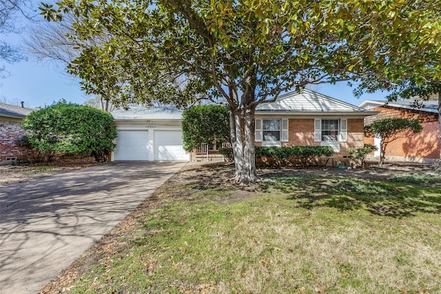 ranch-style house featuring a garage, a front lawn, concrete driveway, and brick siding