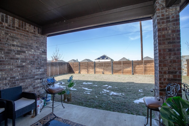 view of yard with a patio area and a fenced backyard