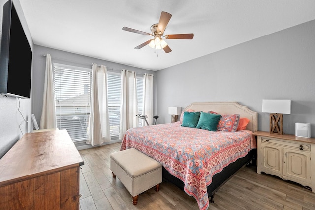 bedroom with light wood finished floors and ceiling fan