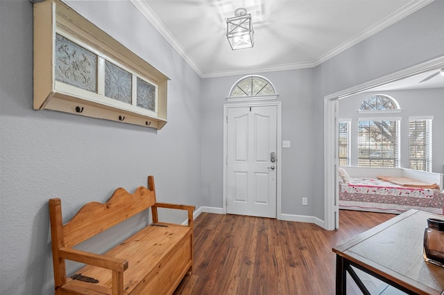 entryway featuring a wealth of natural light, baseboards, crown molding, and wood finished floors