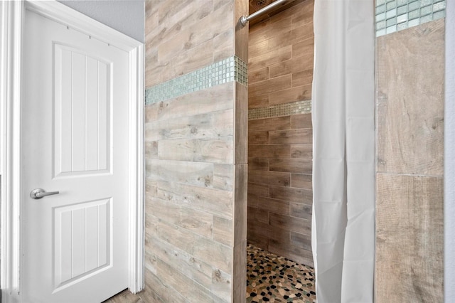 bathroom with tiled shower