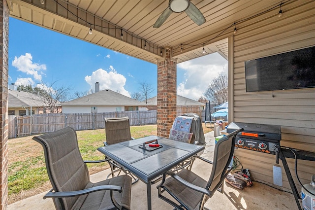 view of patio / terrace with a ceiling fan, outdoor dining area, and a fenced backyard