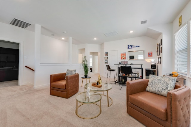 living room with carpet floors, visible vents, vaulted ceiling, and recessed lighting