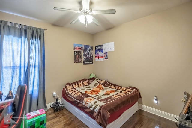 bedroom featuring ceiling fan, baseboards, and dark wood-style flooring