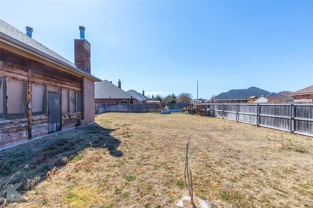 view of yard featuring fence