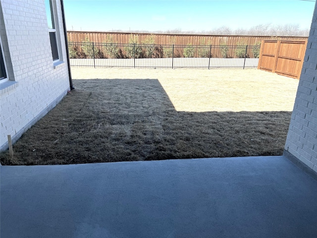 view of yard with a fenced backyard