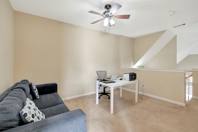 office featuring carpet floors, visible vents, ceiling fan, and baseboards