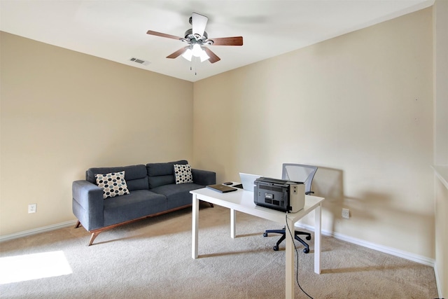 home office featuring baseboards, visible vents, ceiling fan, and carpet flooring