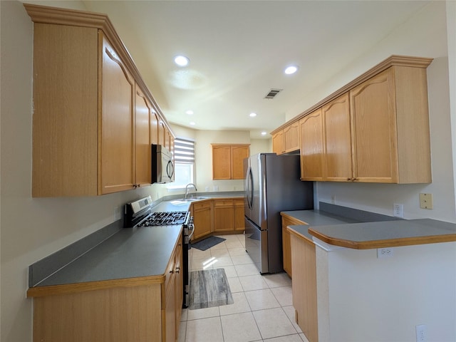 kitchen with visible vents, appliances with stainless steel finishes, a peninsula, light tile patterned flooring, and recessed lighting