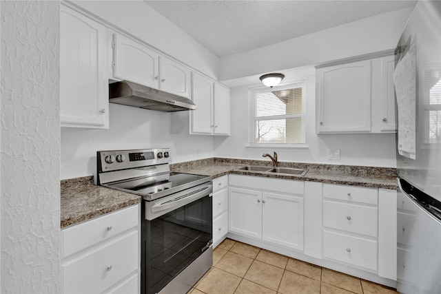 kitchen featuring appliances with stainless steel finishes, a textured ceiling, under cabinet range hood, white cabinetry, and a sink