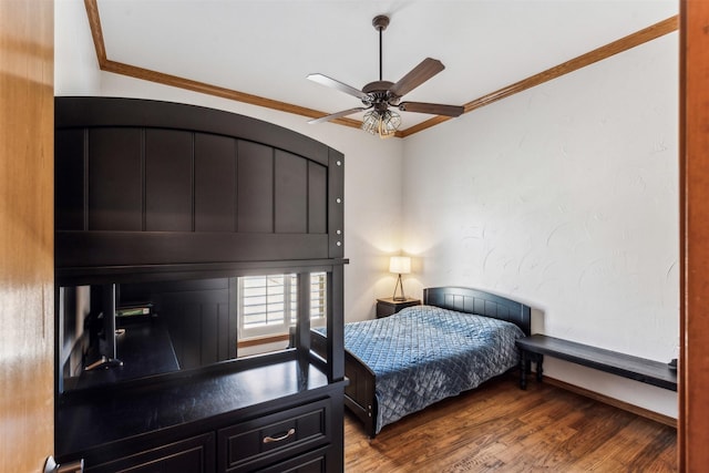 bedroom with ornamental molding, ceiling fan, baseboards, and wood finished floors