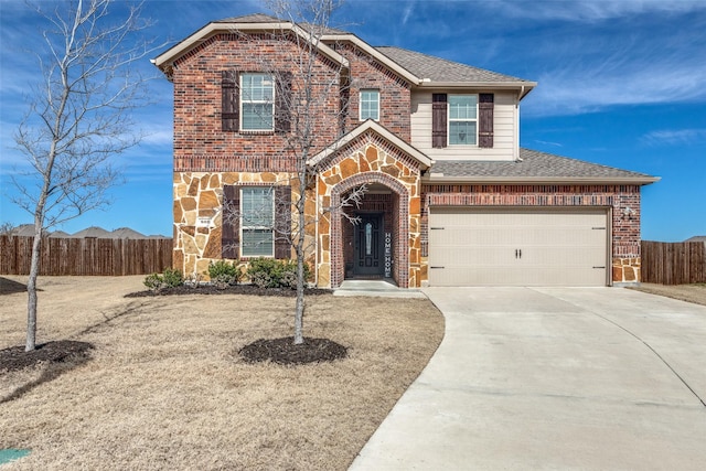 view of front of home with brick siding, roof with shingles, fence, stone siding, and driveway