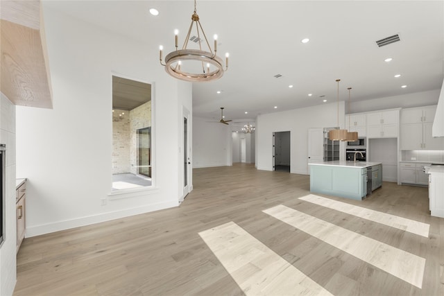 4201 Linear, Prosper, TX 75078 - kitchen with open floor plan, a chandelier, recessed lighting, light countertops, and a center island with sink