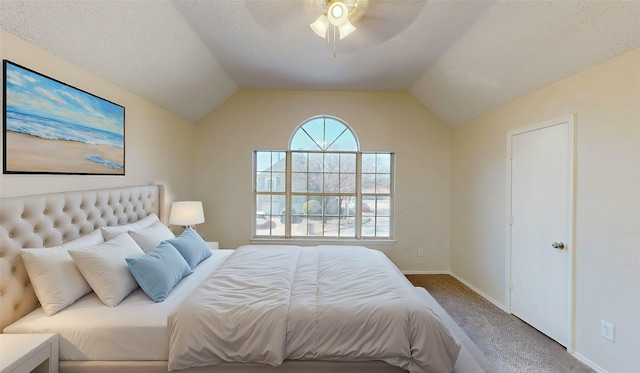 bedroom with vaulted ceiling, carpet, a ceiling fan, and baseboards