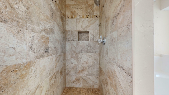 room details featuring a tile shower