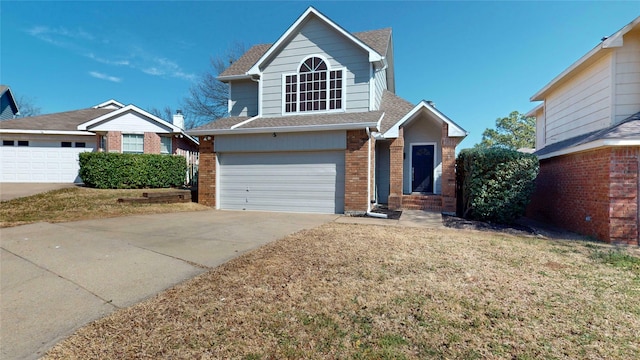 traditional-style home featuring driveway, entry steps, roof with shingles, an attached garage, and brick siding