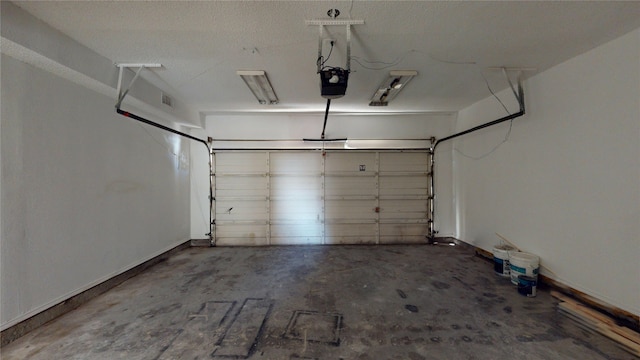 garage featuring baseboards and a garage door opener