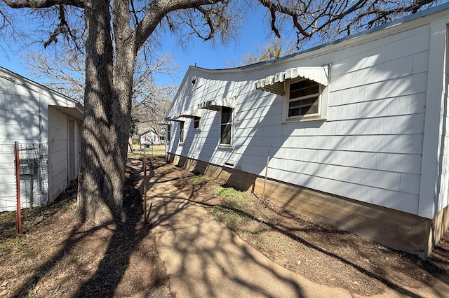 view of property exterior with crawl space