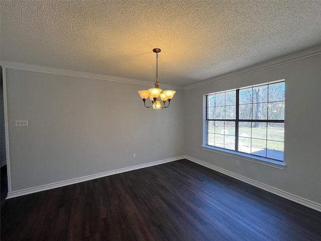 empty room featuring dark wood-type flooring, ornamental molding, baseboards, and an inviting chandelier