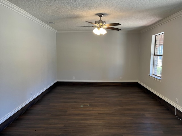 unfurnished room with dark wood-style flooring, visible vents, crown molding, and baseboards