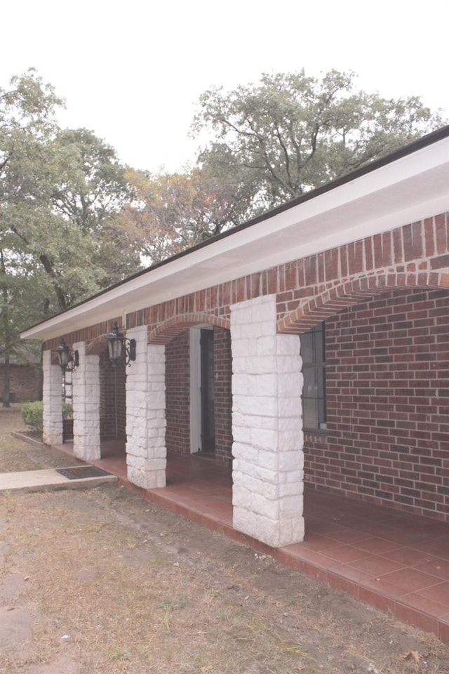 exterior space with brick siding