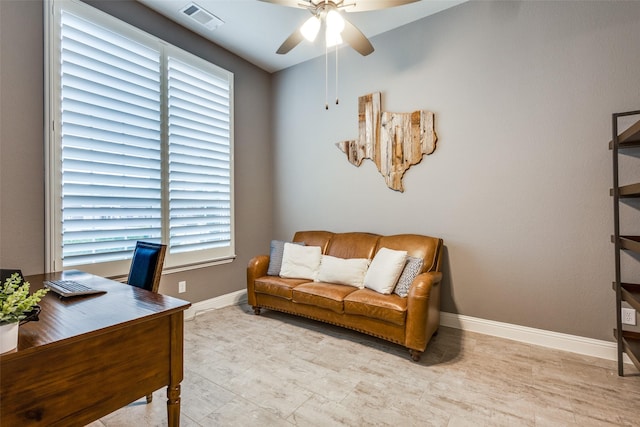 office featuring a ceiling fan, visible vents, and baseboards