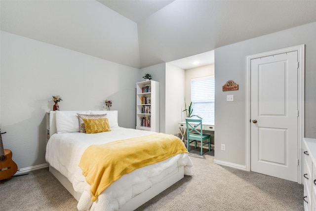 bedroom featuring carpet flooring, vaulted ceiling, and baseboards