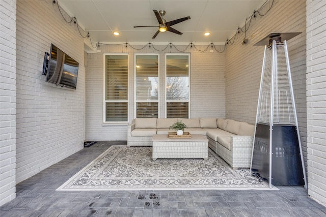 view of patio with outdoor lounge area and a ceiling fan