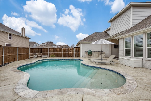 view of swimming pool with a fenced in pool, a fenced backyard, and a patio