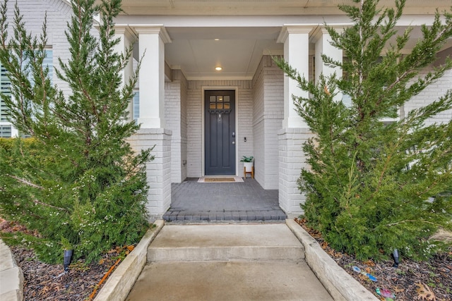 property entrance with brick siding