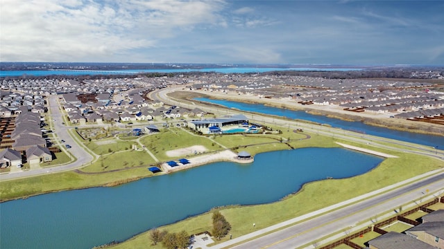 birds eye view of property featuring a water view and a residential view